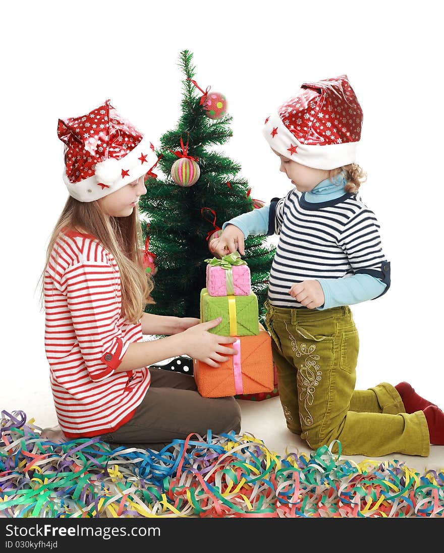 Two little girls at the new year tree. Two little girls at the new year tree