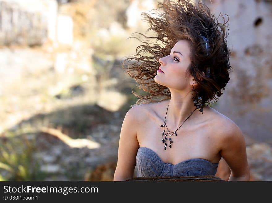 View of a beautiful woman, swinging the hair on a wild way. View of a beautiful woman, swinging the hair on a wild way.