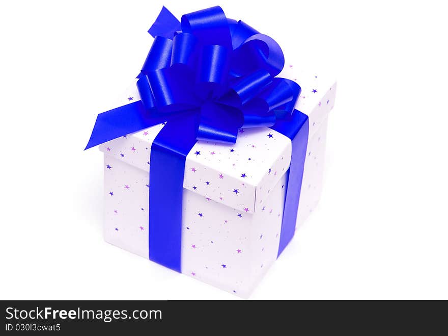 White gift box with blue ribbon isolated on white