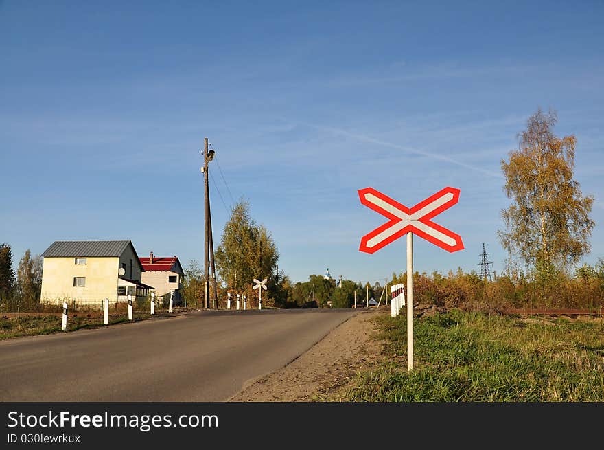 Unguarded railway crossing.