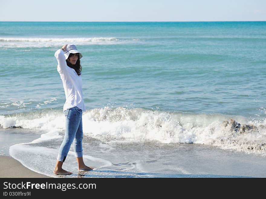 Happy young woman relax onbeautiful beach at morning. Happy young woman relax onbeautiful beach at morning