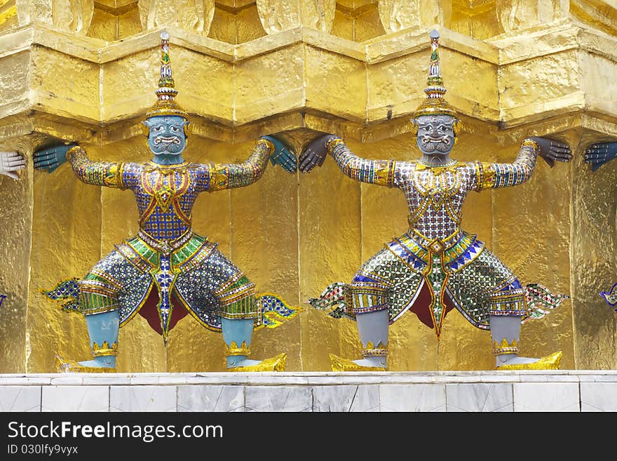 Thai giant design elements of royal gold religious stupa in grand palace, Bangkok Thailand. Thai giant design elements of royal gold religious stupa in grand palace, Bangkok Thailand