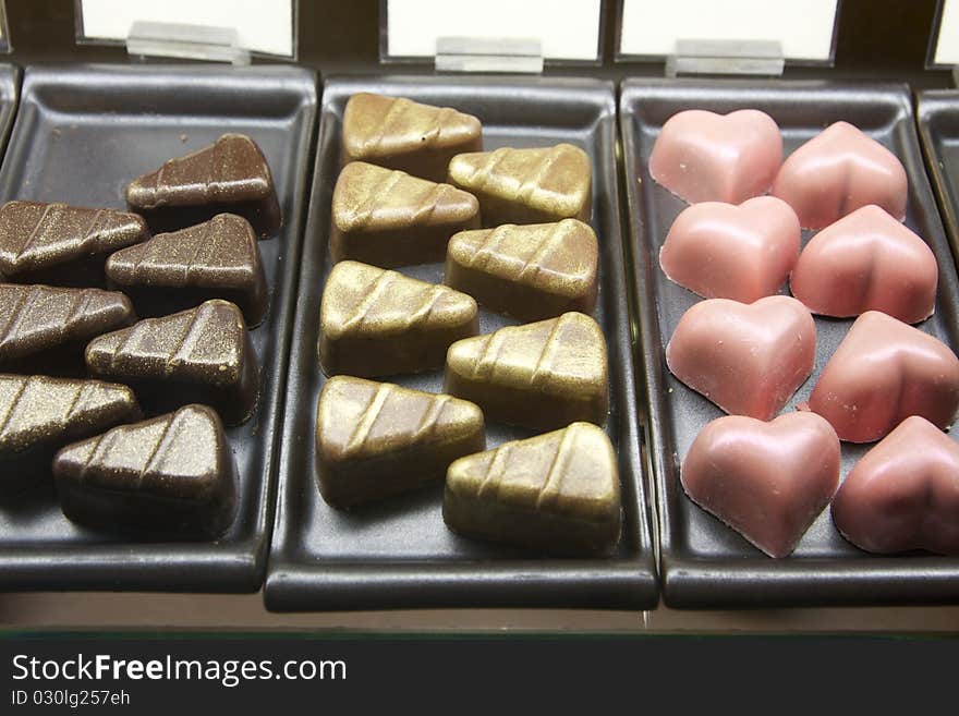 Triangle and heart shape assorted chocolate on trays