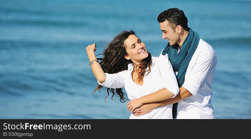 Happy young couple in white clothing  have romantic recreation and   fun at beautiful beach on  vacations. Happy young couple in white clothing  have romantic recreation and   fun at beautiful beach on  vacations