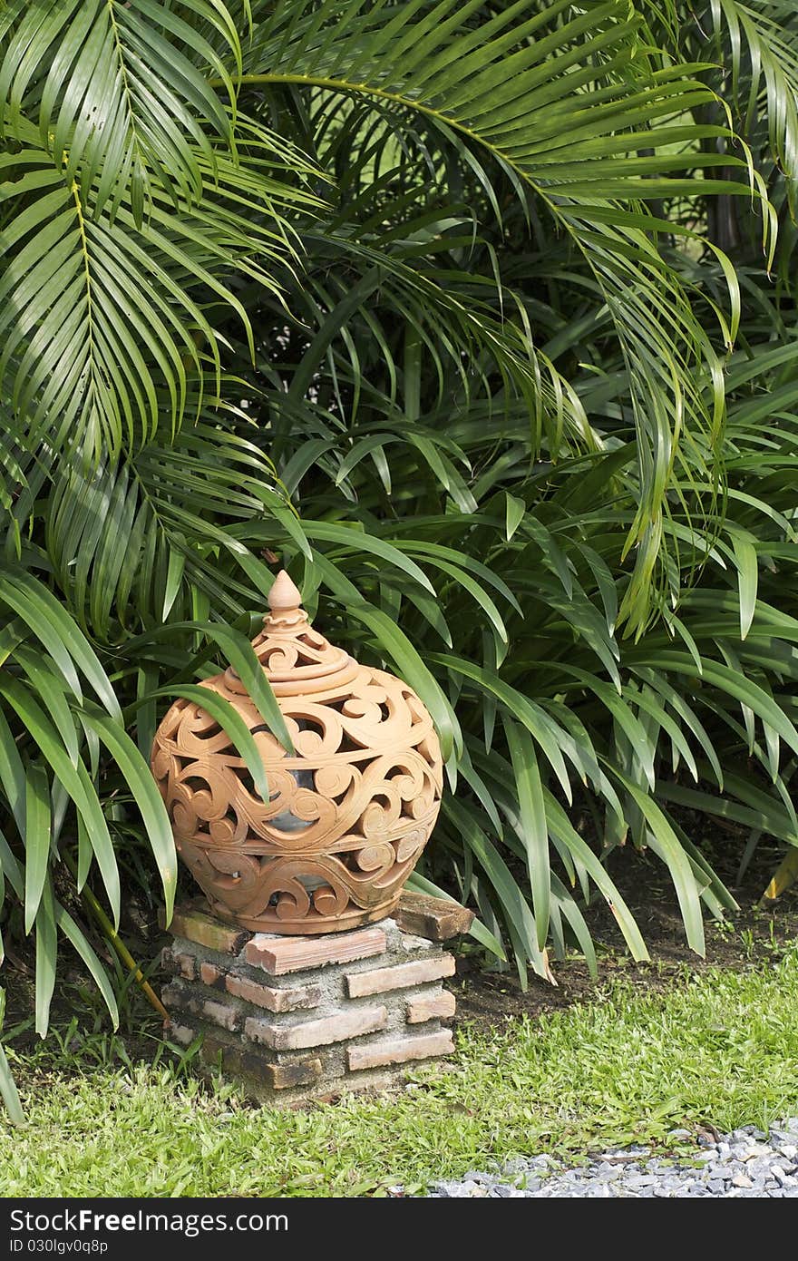 Terracotta lantern earthenware garden decoration in zen stone garden. Terracotta lantern earthenware garden decoration in zen stone garden