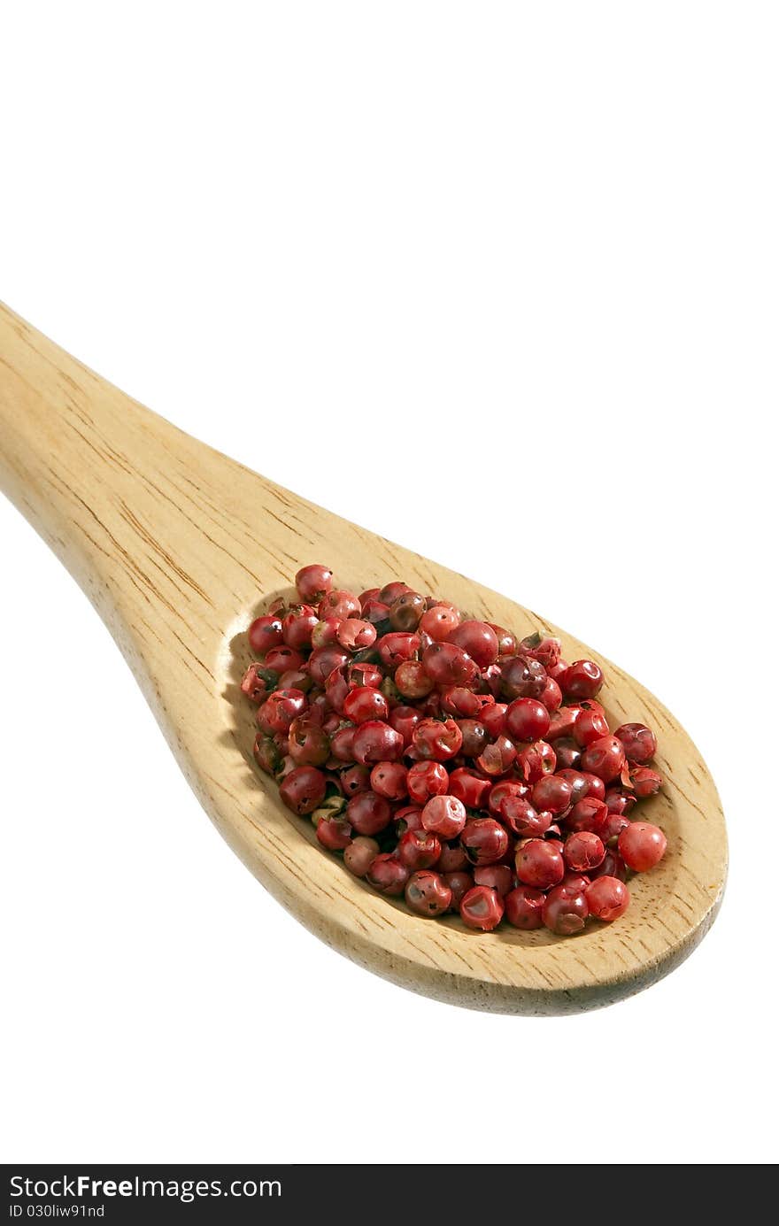 Isolated wooden Spoon with on red pepper it. Isolated wooden Spoon with on red pepper it.