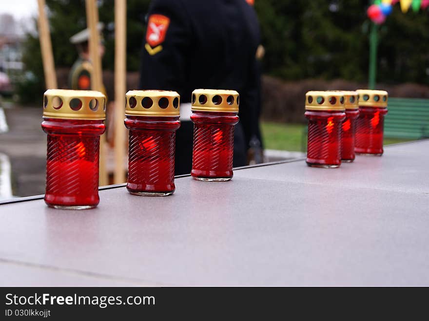 Lamps with candles at a monument