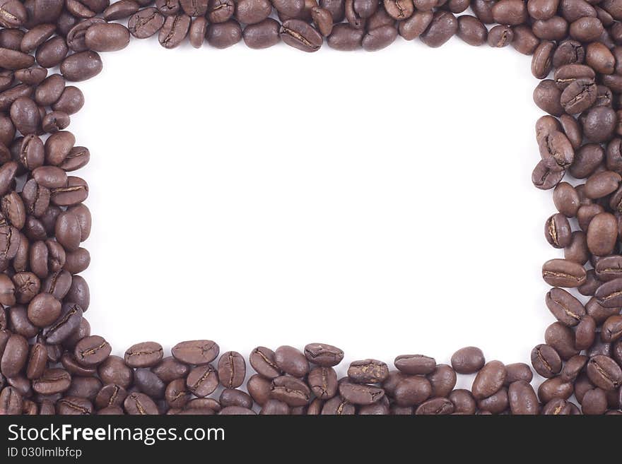 Frame of dark roasted coffee beans isolated on a white background