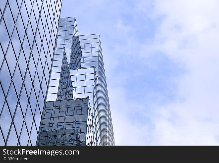 An upwards view of a modern skyscraper. An upwards view of a modern skyscraper