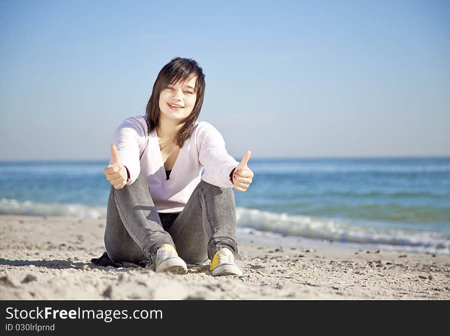 Portrait of brunette girl at the beach.