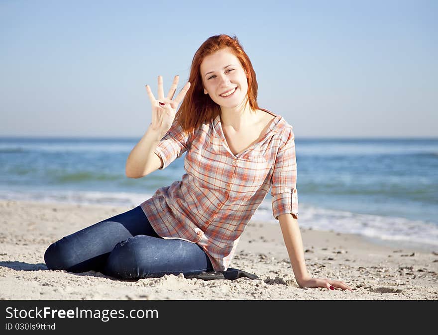 Happy Red-haired Girl At The Beach.