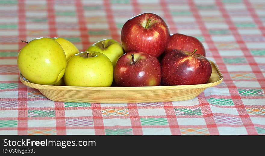 Apple of two kinds displayed on a cloth fabric. Apple of two kinds displayed on a cloth fabric