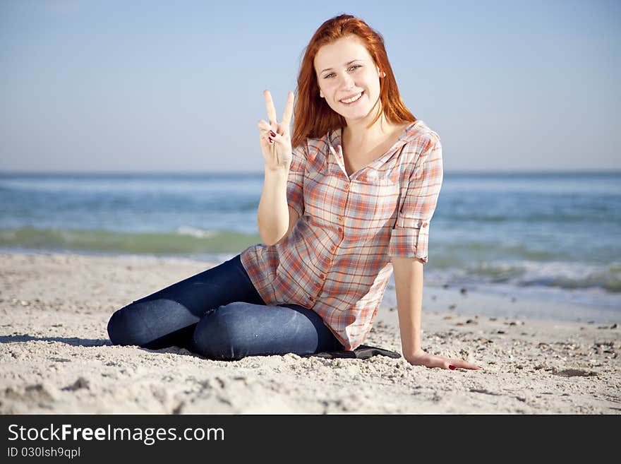 Happy Red-haired Girl At The Beach.