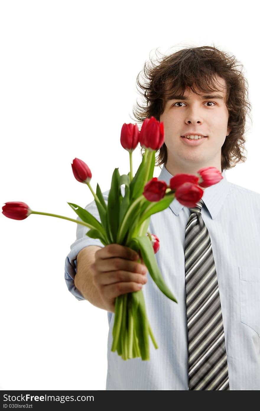 A portrait of a young man with red tulips. A portrait of a young man with red tulips