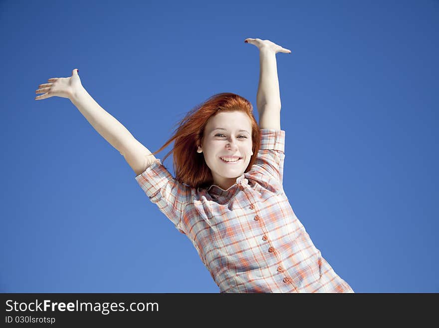 Happy girl at blue background.