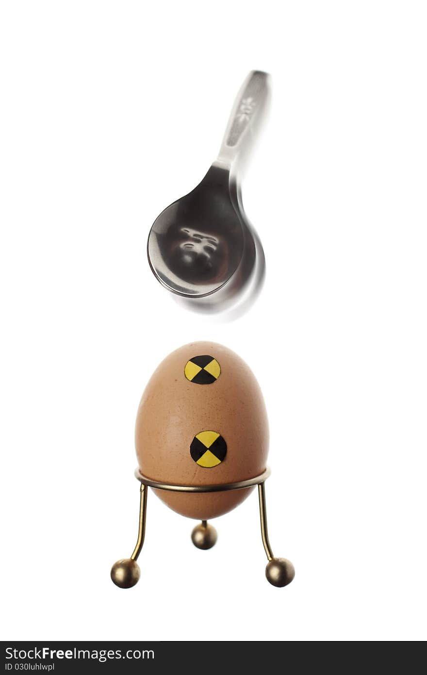 An crash test egg defeating a spoon. An crash test egg defeating a spoon