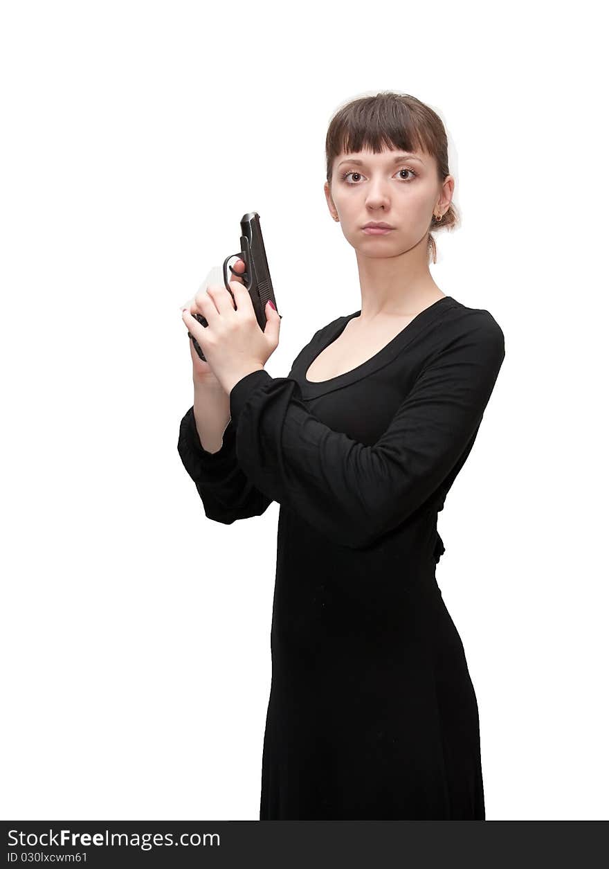 A girl with a black handgun on white background. A girl with a black handgun on white background