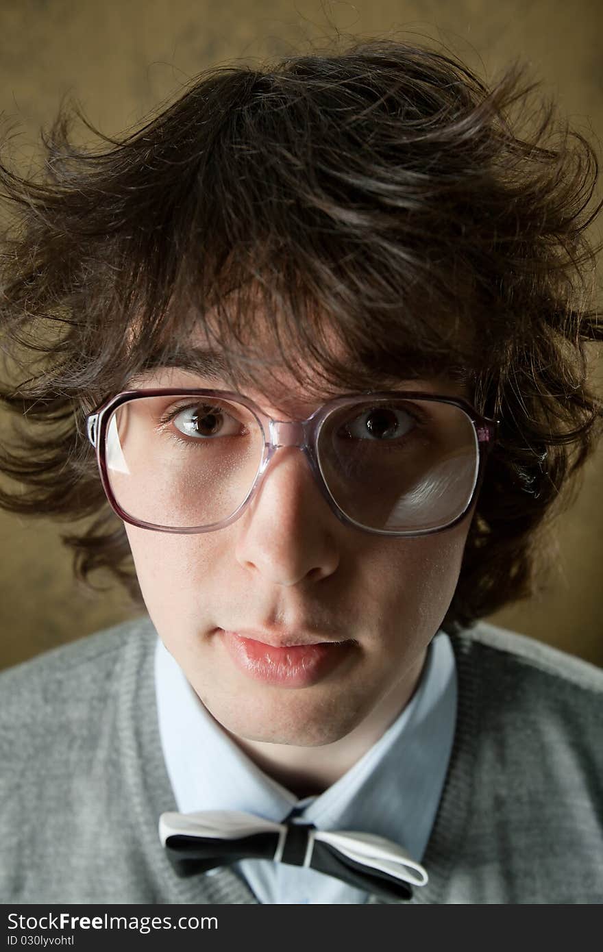 An image of young man in very big glasses