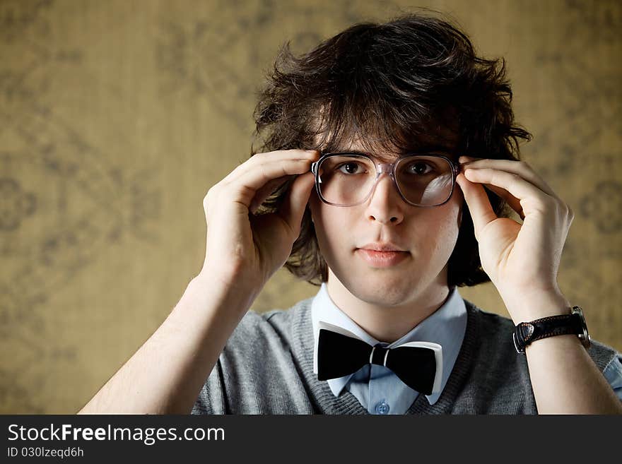 An image of a young man in big glasses. An image of a young man in big glasses