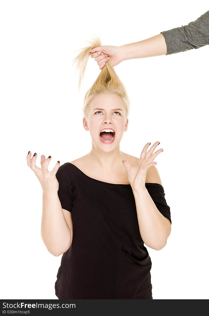 Blond woman in pain because someone pulling her hair. Blond woman in pain because someone pulling her hair