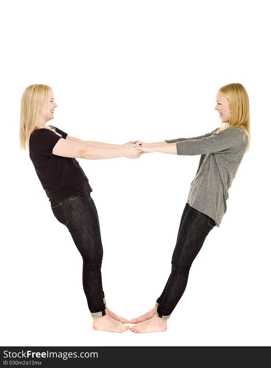 Two girls holding each others hands. Two girls holding each others hands