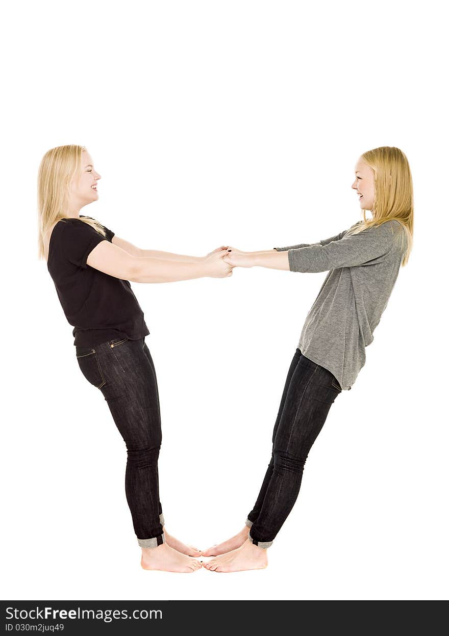 Two girls holding each others hands. Two girls holding each others hands