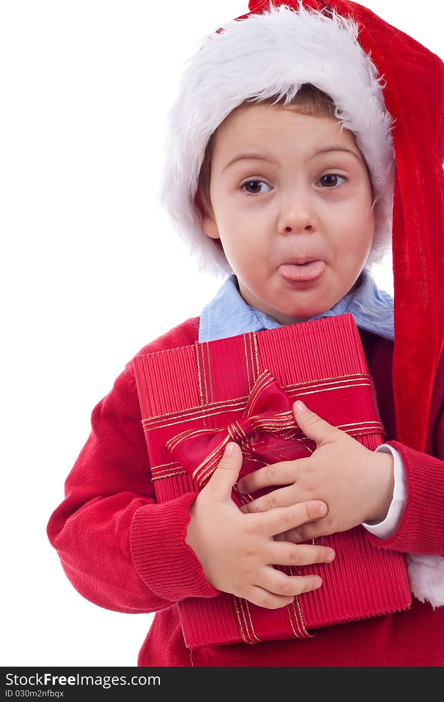 Little kid holding present and sticking out his tongue over white. Little kid holding present and sticking out his tongue over white