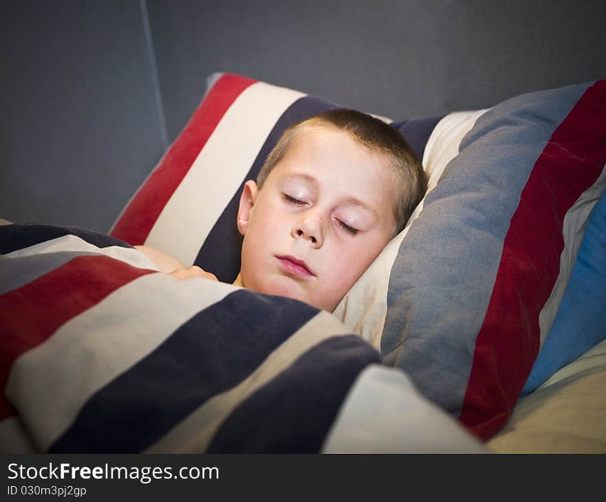 Young Boy sleeping in his bed