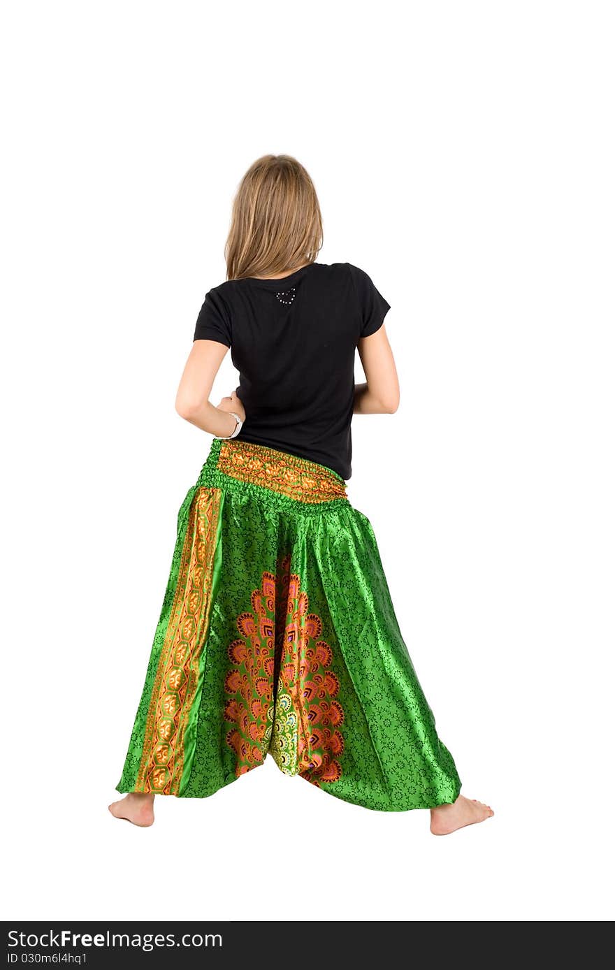 Girl in ethnic trousers posing in studio