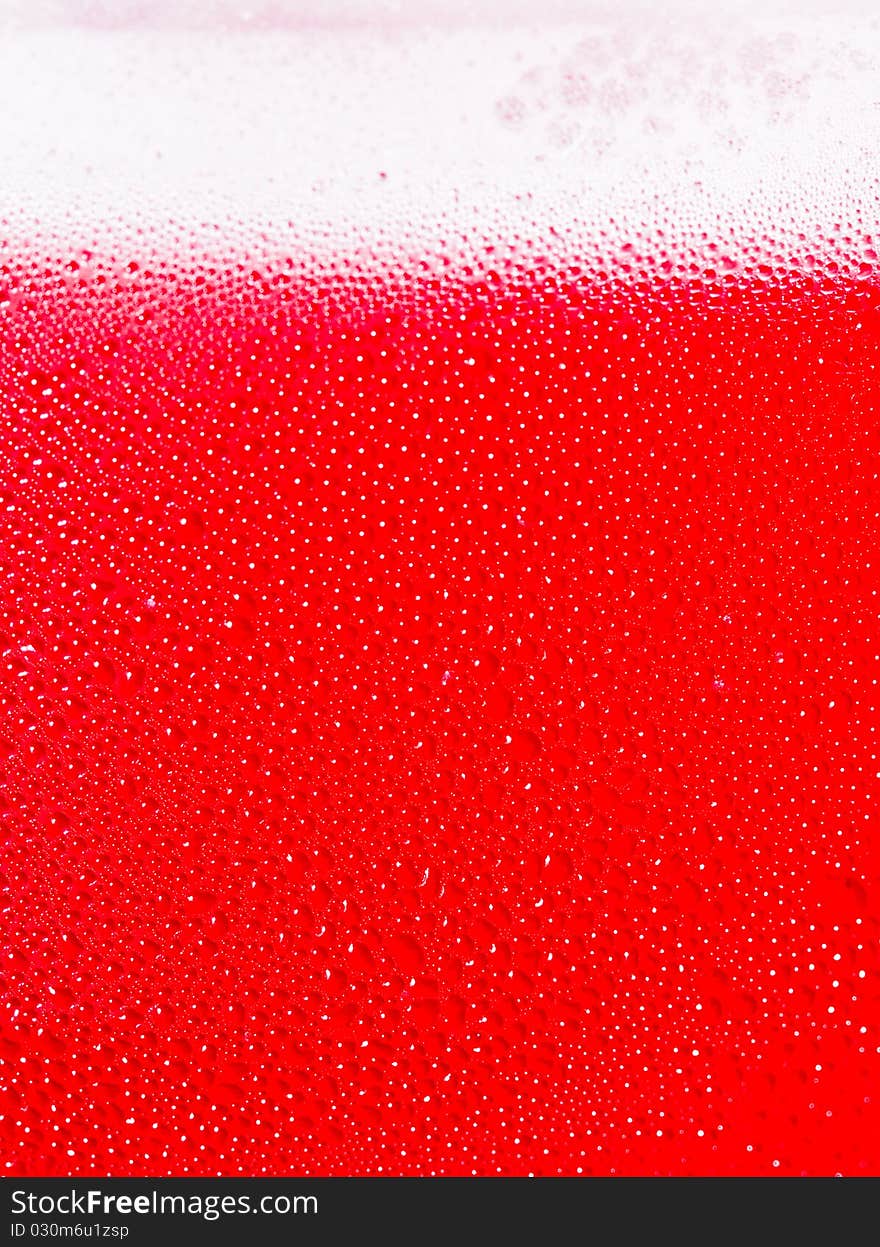 Red cold bottle and water drops. Red cold bottle and water drops