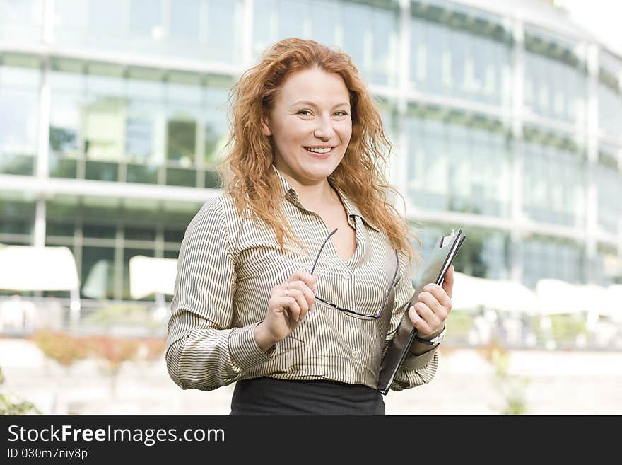 Office worker posing for camera indoor