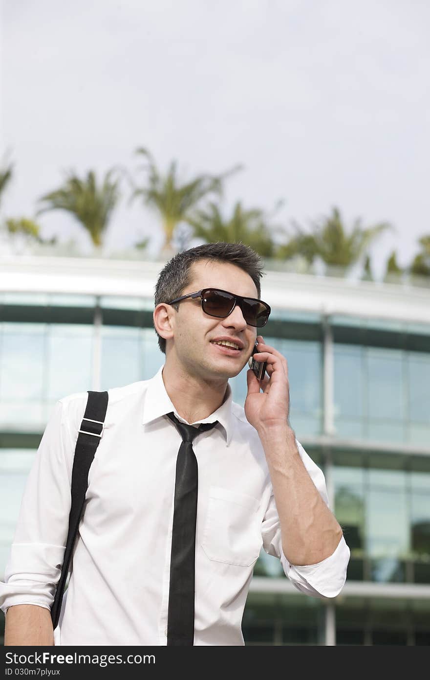 Manager speak on phone across office