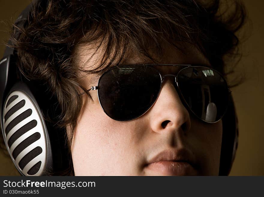 A portrait of a man listening to music in headphones. A portrait of a man listening to music in headphones