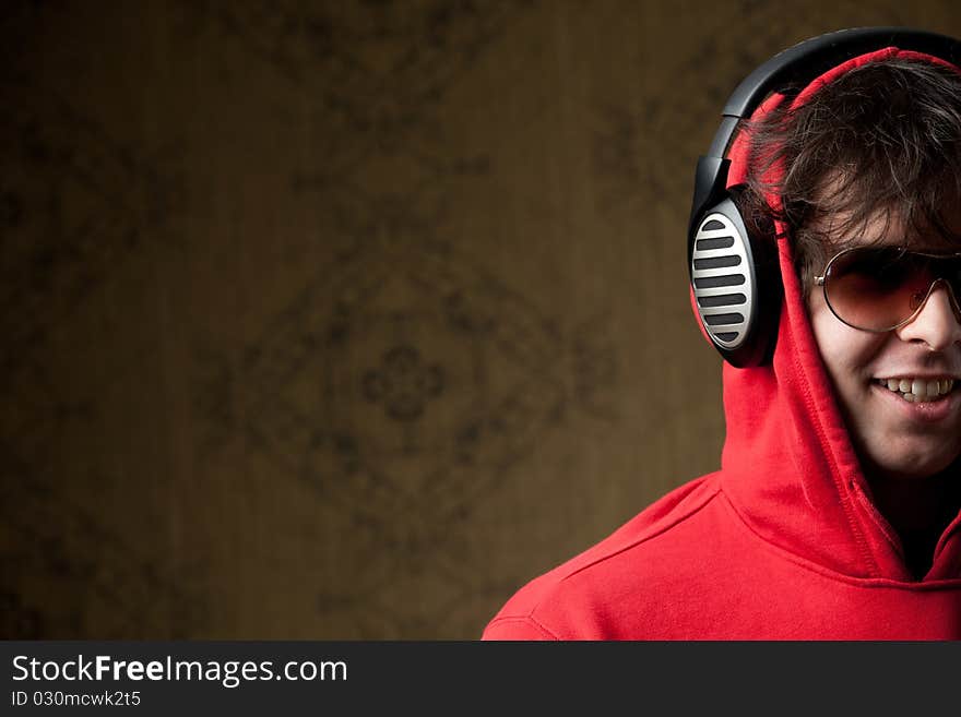 An image of a young boy listening to music in headphones