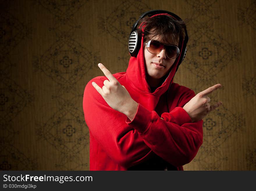 An image of a young boy listening to music in headphones