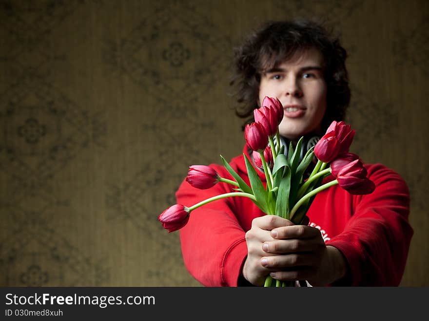 Young man with tulips