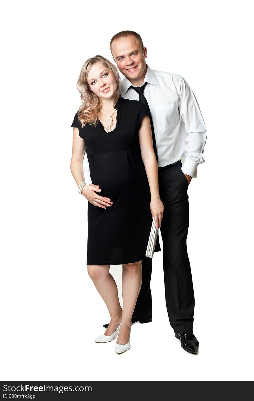 An image of a young pregnant woman and her husband. An image of a young pregnant woman and her husband