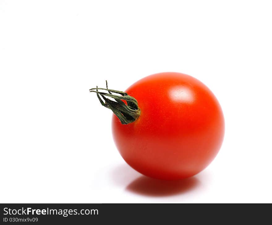 Beautiful red cherry tomato isolated on white