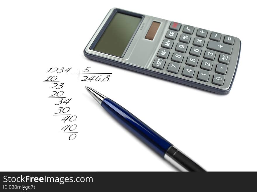 The calculator lies on a background, calculation in the manual,adherence to all become outdated. The calculator lies on a background, calculation in the manual,adherence to all become outdated