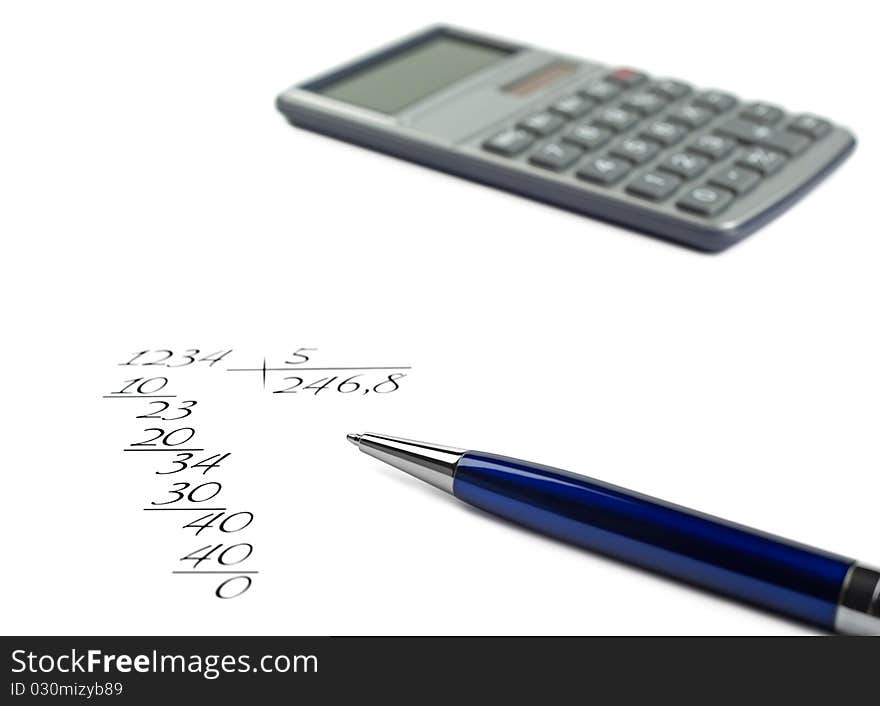 The calculator lies on a background, calculation in the manual,adherence to all become outdated