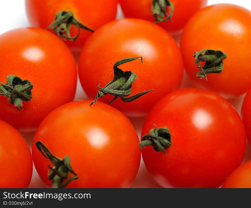 Many Beautiful red cherry tomato isolated on white background