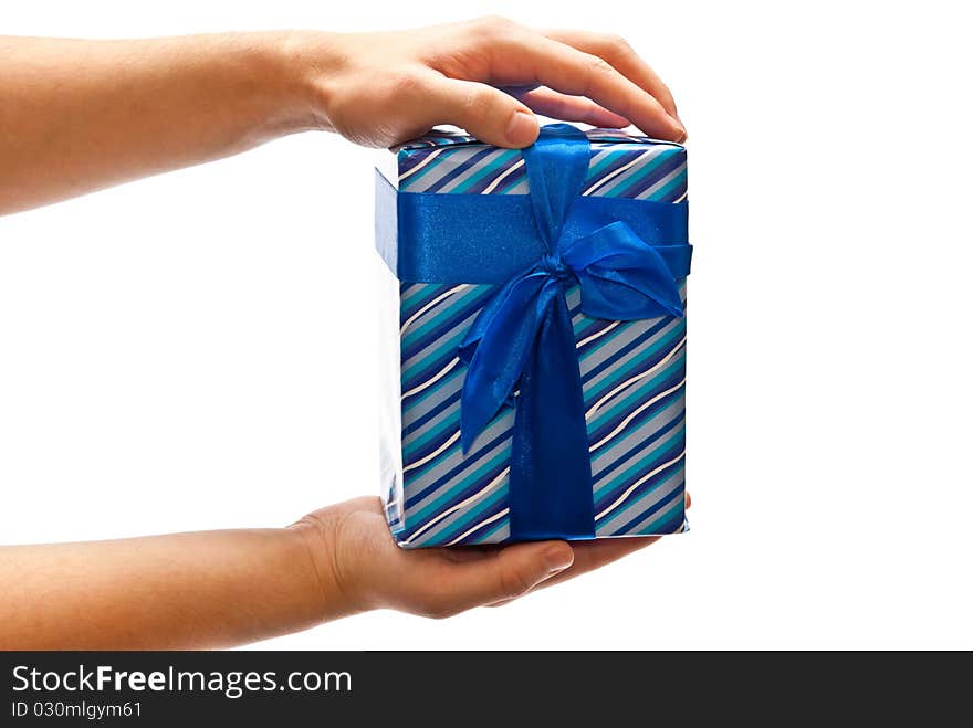 Blue gift box with bow in man's hands. Isolated on white. Blue gift box with bow in man's hands. Isolated on white