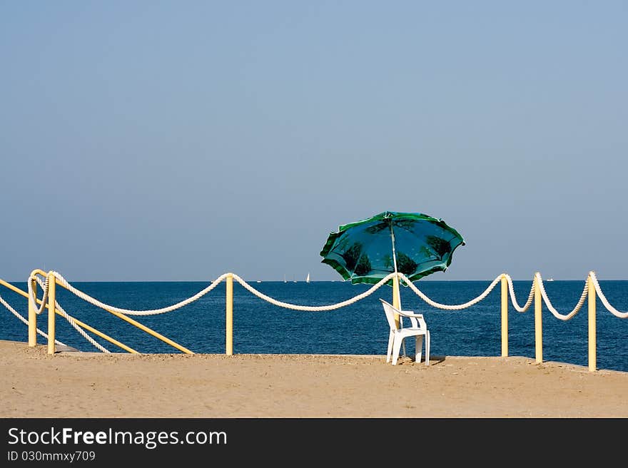 Easy Chair And Umbrella Near The Tightrope