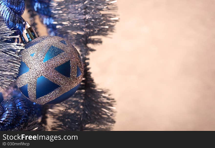 Blue Christmas ball with glitter, extreme close-up