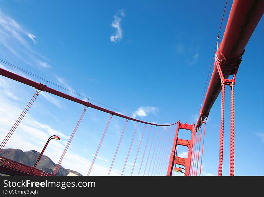 Fragment view on Golden Gate bridge in daylight, vertical. San-Francisco, California, USA. Fragment view on Golden Gate bridge in daylight, vertical. San-Francisco, California, USA