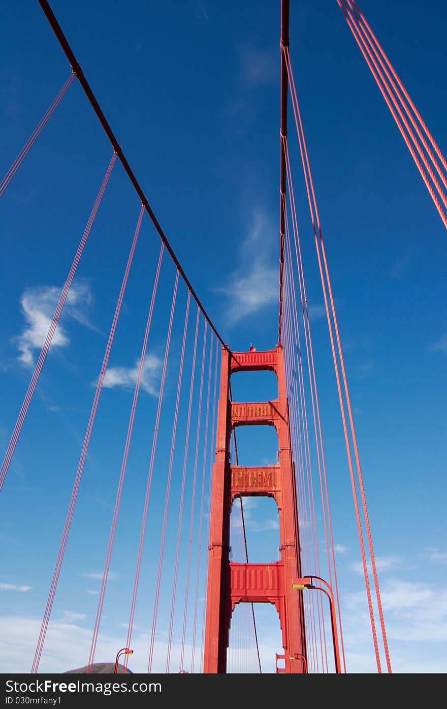 Fragment view on Golden Gate bridge in daylight, vertical. San-Francisco, California, USA. Fragment view on Golden Gate bridge in daylight, vertical. San-Francisco, California, USA