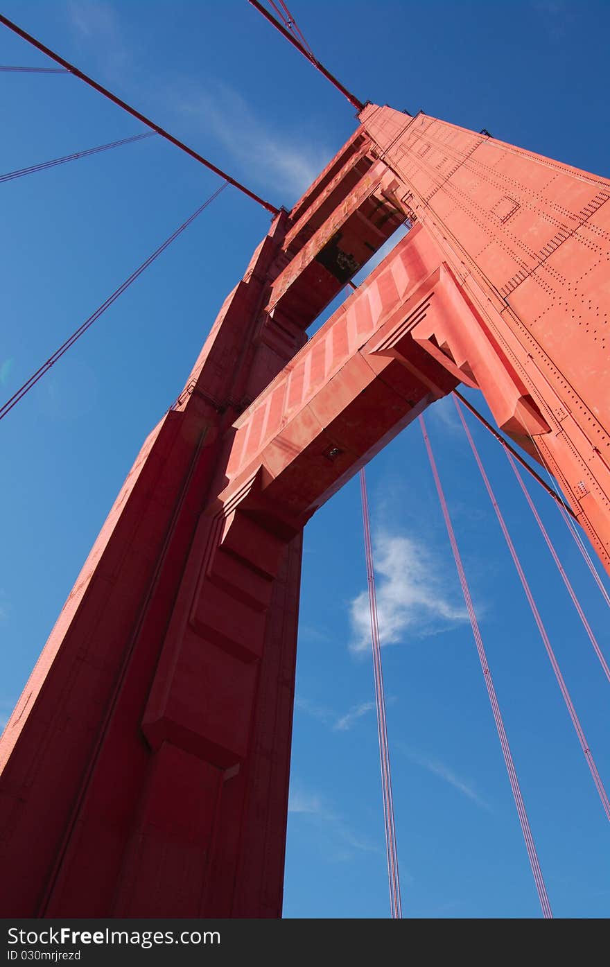 Fragment view on Golden Gate bridge in daylight, vertical. San-Francisco, California, USA. Fragment view on Golden Gate bridge in daylight, vertical. San-Francisco, California, USA