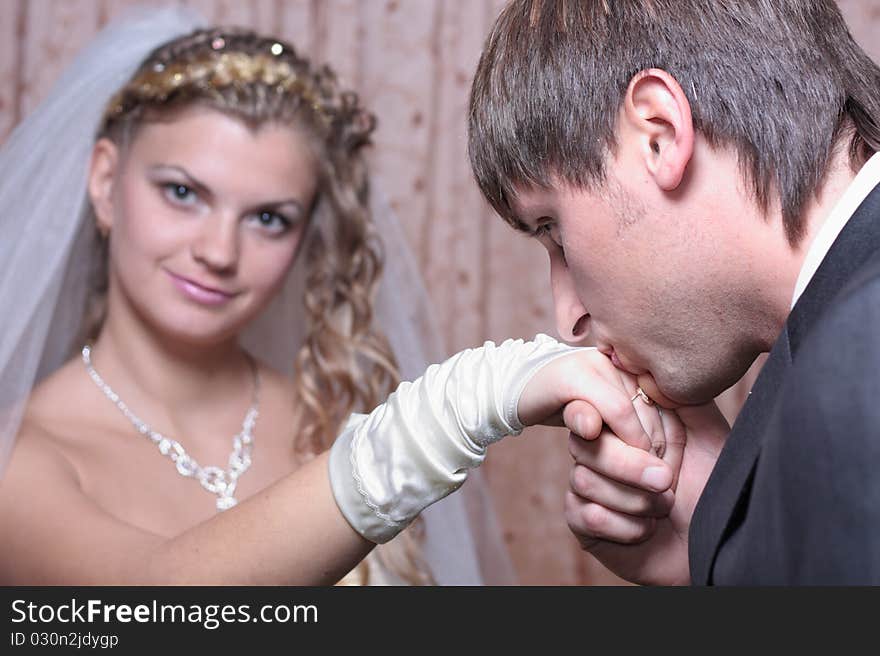 Groom Kissing Hand Of Smiling Bride