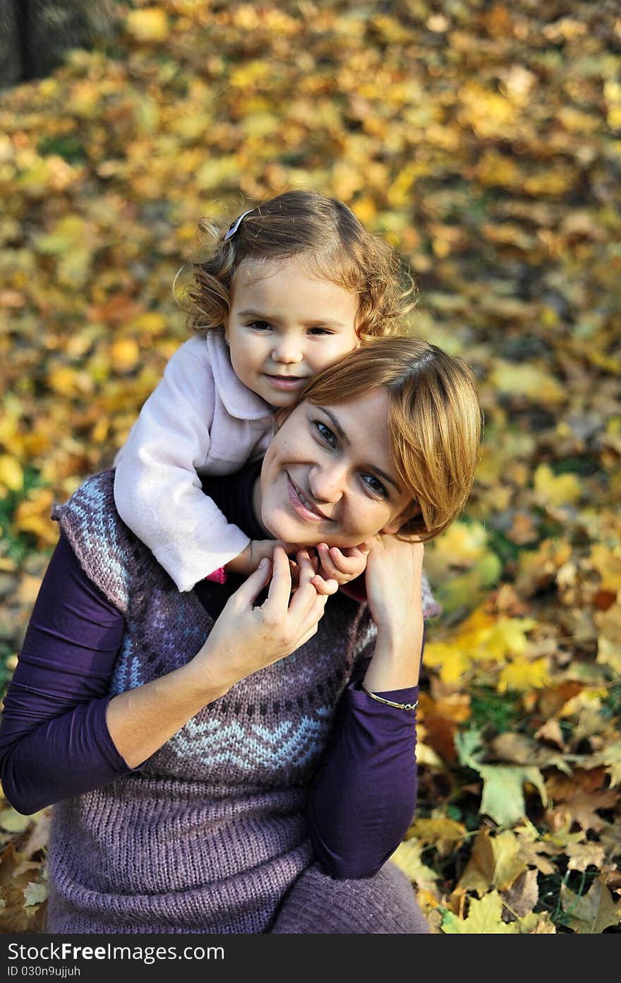 Portrait with little girl hugging her mom. Portrait with little girl hugging her mom