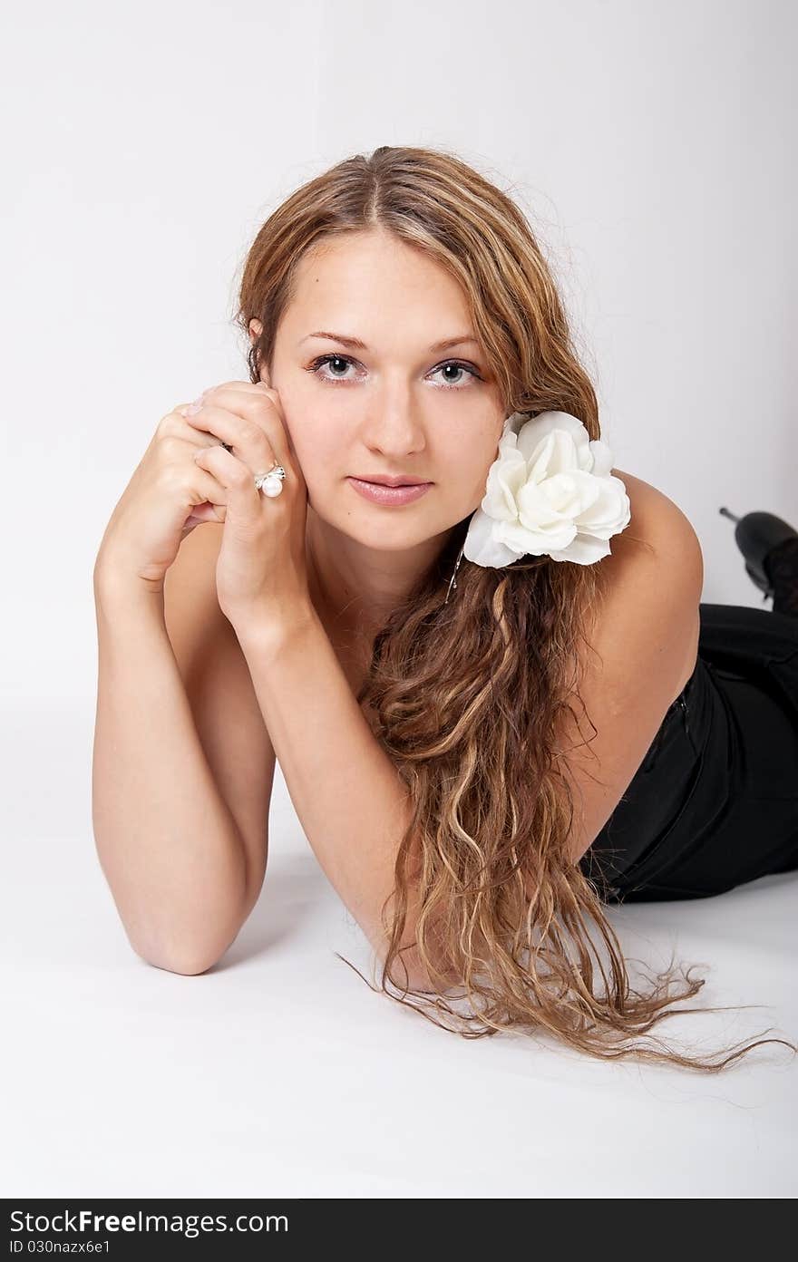 In the photo beautiful young girl on a white background. In the photo beautiful young girl on a white background